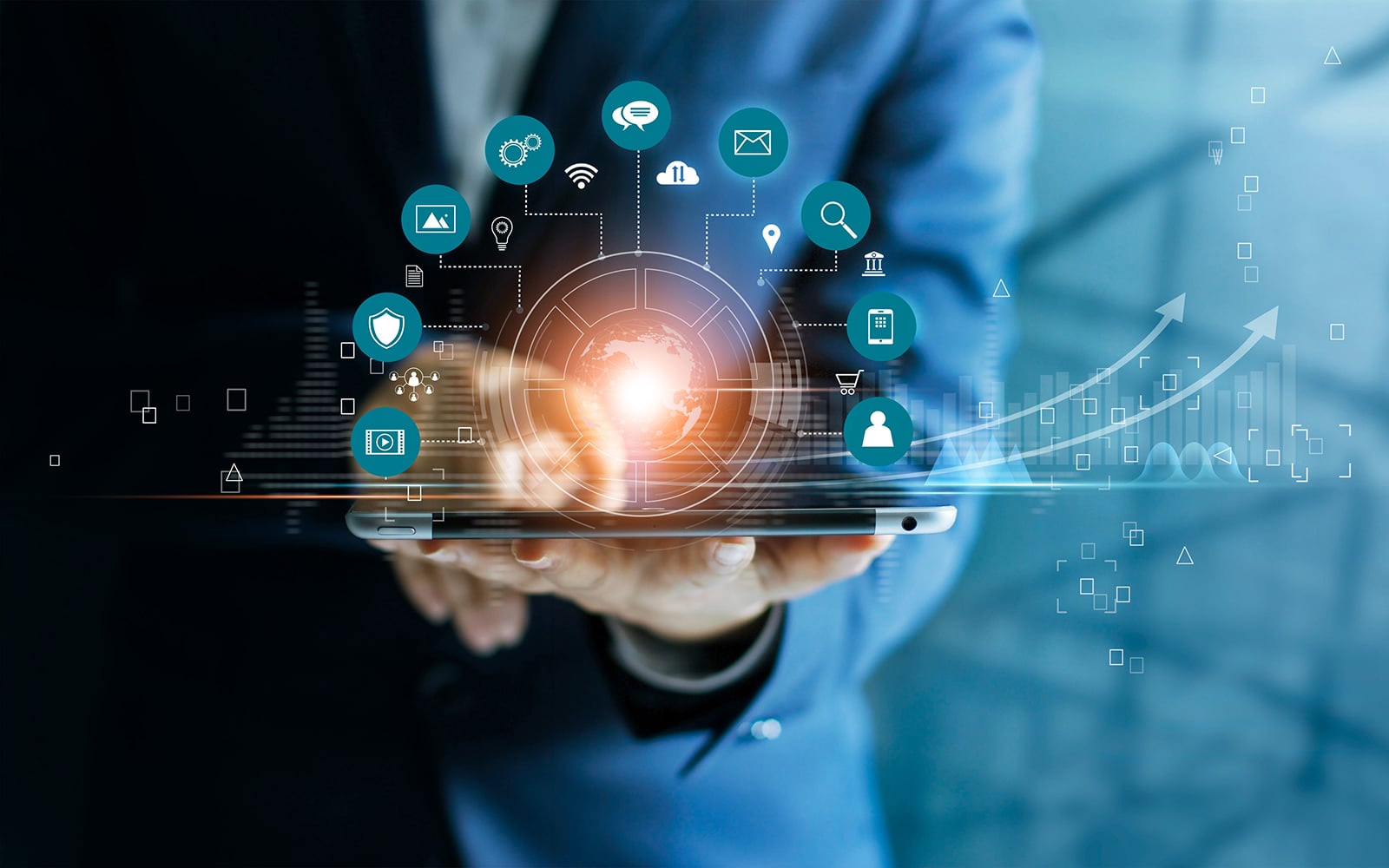 Businessman using tablet analyzing sales data and economic growt